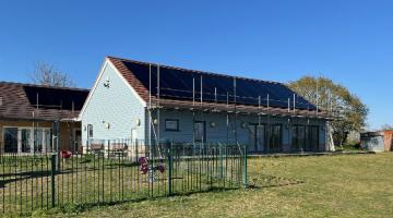 Village hall image with solar panels 