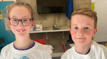 A smiling girl and boy from Little Miracles